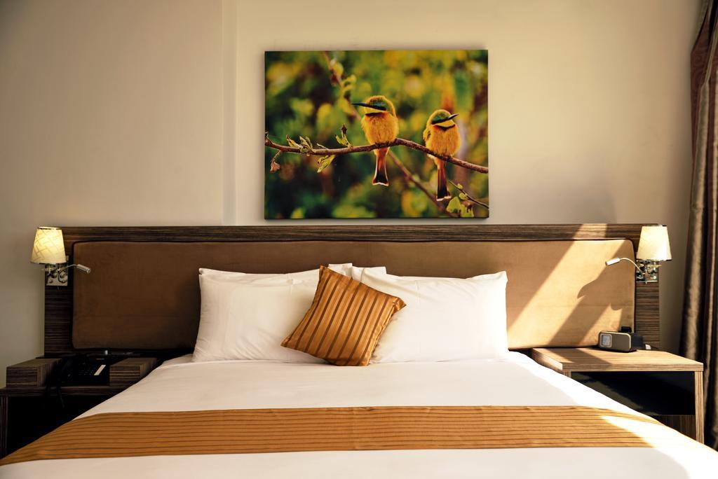 Golden Tulip Dar Es Salaam City Center Hotel Room photo